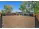 Large backyard featuring trees, wood fencing, and plenty of potential at 1089 S Osceola St, Denver, CO 80219