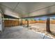 Covered backyard patio with a concrete surface overlooking the spacious backyard at 1089 S Osceola St, Denver, CO 80219