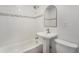 Bathroom with a soaking tub, sink and shower combo, and tiled shower at 1089 S Osceola St, Denver, CO 80219