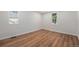 Bright bedroom featuring new floors, white trim, and neutral paint at 1089 S Osceola St, Denver, CO 80219
