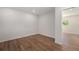 Cozy bedroom with hardwood floors, neutral tones, and a view to the backyard, creating a serene retreat at 1089 S Osceola St, Denver, CO 80219