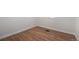Cozy bedroom with wood flooring, white trim, and neutral paint at 1089 S Osceola St, Denver, CO 80219