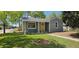 Charming single-Gathering home with a well-manicured lawn and a bright yellow front door at 1089 S Osceola St, Denver, CO 80219