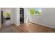 Practical laundry room showcasing a stacked washer and dryer with ample natural light at 1089 S Osceola St, Denver, CO 80219