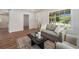 Comfortable living room featuring natural light, a cozy couch, and stylish decor enhancing the inviting space at 1089 S Osceola St, Denver, CO 80219