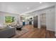 Bright, open-concept space connecting a modern kitchen with a comfortable living area, ideal for entertaining at 1089 S Osceola St, Denver, CO 80219
