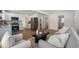 Open-concept layout seamlessly connecting the updated kitchen and cozy living room, perfect for modern living at 1089 S Osceola St, Denver, CO 80219