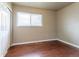 This bedroom features a large window with natural light and a closet with sliding doors at 3632 Leyden St, Denver, CO 80207