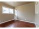 Cozy bedroom with hardwood floors, built-in shelving, and a large window at 3632 Leyden St, Denver, CO 80207