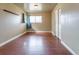 Comfortable bedroom with wood floors, closet, and natural light at 3632 Leyden St, Denver, CO 80207