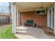 Cozy covered patio area with string lights and seating, perfect for relaxing outdoors at 3632 Leyden St, Denver, CO 80207