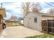 Detached garage with concrete driveway, storage, and ample parking space at 3632 Leyden St, Denver, CO 80207