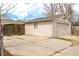Detached garage with concrete driveway, storage, and ample parking space at 3632 Leyden St, Denver, CO 80207