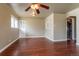 Open living area with hardwood floors, built-in shelving, and open kitchen view at 3632 Leyden St, Denver, CO 80207