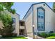 Inviting exterior of a multi-story condo complex showcasing reserved parking and lush landscaping at 447 S Memphis Way # 7, Aurora, CO 80017