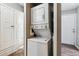 A compact laundry area featuring a stacked washer and dryer unit at 447 S Memphis Way # 7, Aurora, CO 80017