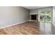 Spacious living room with a stone fireplace and sliding glass doors leading to the exterior at 447 S Memphis Way # 7, Aurora, CO 80017