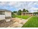 View of a house with a well-maintained backyard, shed, and gravel area at 2321 Lima St, Aurora, CO 80010