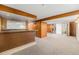 Basement bar area featuring dark wood bar with tiled accents, perfect for entertaining friends and Gathering at 2321 Lima St, Aurora, CO 80010