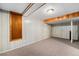 Spacious basement area featuring paneled walls and ample space for customized living at 2321 Lima St, Aurora, CO 80010
