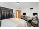 Spacious bedroom featuring hardwood floors, a king bed, and dedicated workspace for ultimate convenience at 2321 Lima St, Aurora, CO 80010