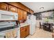 Functional kitchen with ample cabinet space, modern appliances, and a cozy breakfast nook for casual dining at 2321 Lima St, Aurora, CO 80010