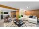 Inviting living room with a cozy sectional sofa, modern coffee table, and neutral decor at 2321 Lima St, Aurora, CO 80010