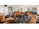 Inviting living room with hardwood floors, comfortable seating, and natural light, perfect for relaxation at 2321 Lima St, Aurora, CO 80010