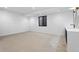 Spacious basement rec room with stylish wet bar area, and window well at 2376 S Bannock St, Denver, CO 80223