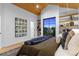 Bright bedroom featuring a wood ceiling, built-in shelves, and a large window with a stunning view at 2376 S Bannock St, Denver, CO 80223