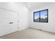 Bedroom with neutral walls, plush carpet, closet and a window letting in natural light at 2376 S Bannock St, Denver, CO 80223
