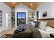 Beautifully appointed bedroom with wood ceiling, modern decor, and neighborhood views at 2376 S Bannock St, Denver, CO 80223