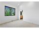 Bright bedroom boasts plush carpeting, and a pass-through to an en suite bathroom at 2376 S Bannock St, Denver, CO 80223