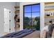 Bedroom with big window, neighborhood views, light walls, and floating shelves at 2376 S Bannock St, Denver, CO 80223