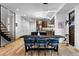 Modern dining area with contemporary lighting and a view into the kitchen at 2376 S Bannock St, Denver, CO 80223