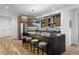 Well-equipped kitchen with stainless steel appliances, a central island, and modern cabinetry at 2376 S Bannock St, Denver, CO 80223