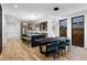 Open-concept kitchen and dining area featuring a modern island, stainless steel appliances, and sleek cabinetry at 2376 S Bannock St, Denver, CO 80223
