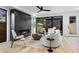 Cozy living room with a modern fireplace, comfortable seating, and a view to the backyard at 2376 S Bannock St, Denver, CO 80223
