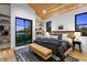 Serene main bedroom featuring a large window, vaulted ceiling, and custom shelves at 2376 S Bannock St, Denver, CO 80223