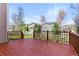 Relaxing outdoor deck overlooking the beautifully landscaped backyard and neighboring homes at 5017 Bella Vista Dr, Longmont, CO 80503