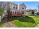 Expansive backyard with a cozy deck, perfect for outdoor living and entertaining at 5017 Bella Vista Dr, Longmont, CO 80503