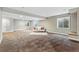 Spacious basement living room with neutral carpet and modern decor at 5017 Bella Vista Dr, Longmont, CO 80503