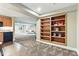 Open basement with a kitchen area and a bookshelf at 5017 Bella Vista Dr, Longmont, CO 80503