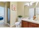 Clean bathroom with vanity, tile floor, and framed shower; features neutral tones and a relaxing atmosphere at 5017 Bella Vista Dr, Longmont, CO 80503