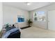 Minimalist bedroom features a neutral palette, bright window, and comfortable workout area at 5017 Bella Vista Dr, Longmont, CO 80503