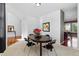 Dining room featuring a dark wood table, white walls, and carpeted floor at 5017 Bella Vista Dr, Longmont, CO 80503