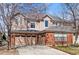 Charming home features a three-car garage and brick-and-siding facade at 5017 Bella Vista Dr, Longmont, CO 80503