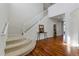 Bright entryway with hardwood floors, staircase, and view of the second level at 5017 Bella Vista Dr, Longmont, CO 80503