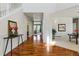Open foyer with hardwood floors and view into other rooms of the house at 5017 Bella Vista Dr, Longmont, CO 80503