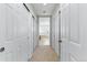 Hallway view leading to bathroom with tub at 5017 Bella Vista Dr, Longmont, CO 80503